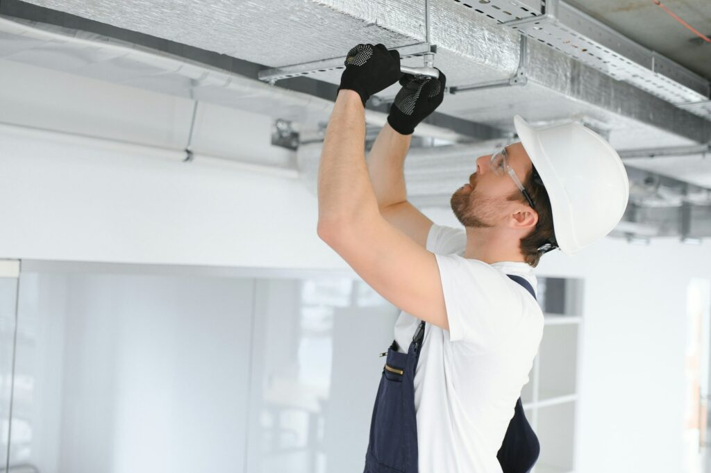 ventilation-system-installation-and-repair-service-hvac-technician-at-work-banner-copy-space.jpg
